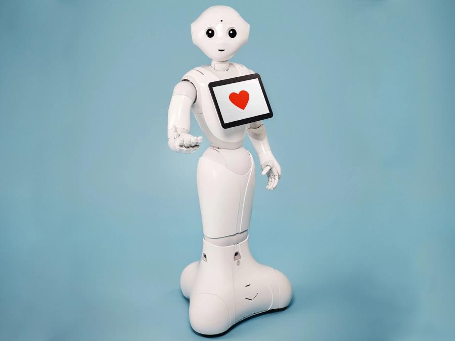 Pepper, robot humanoïde blanc avec sa tablette sur le torse.